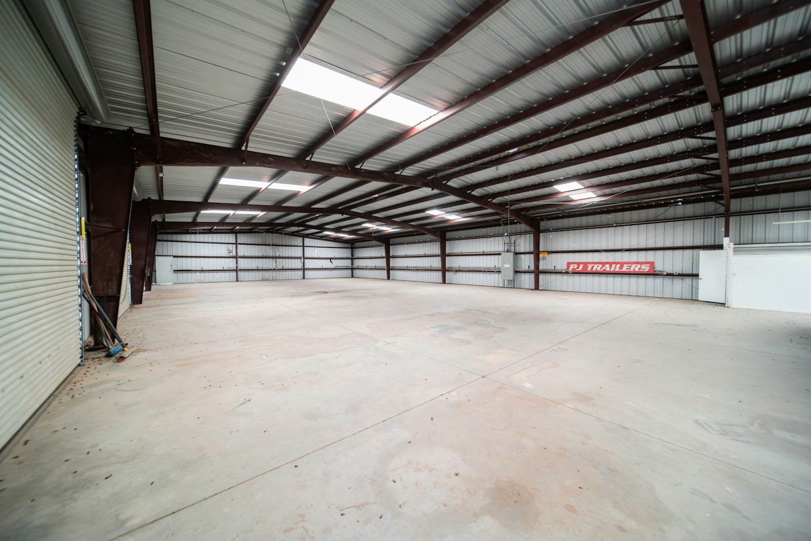 Warehouse interior with commercial overhead door access