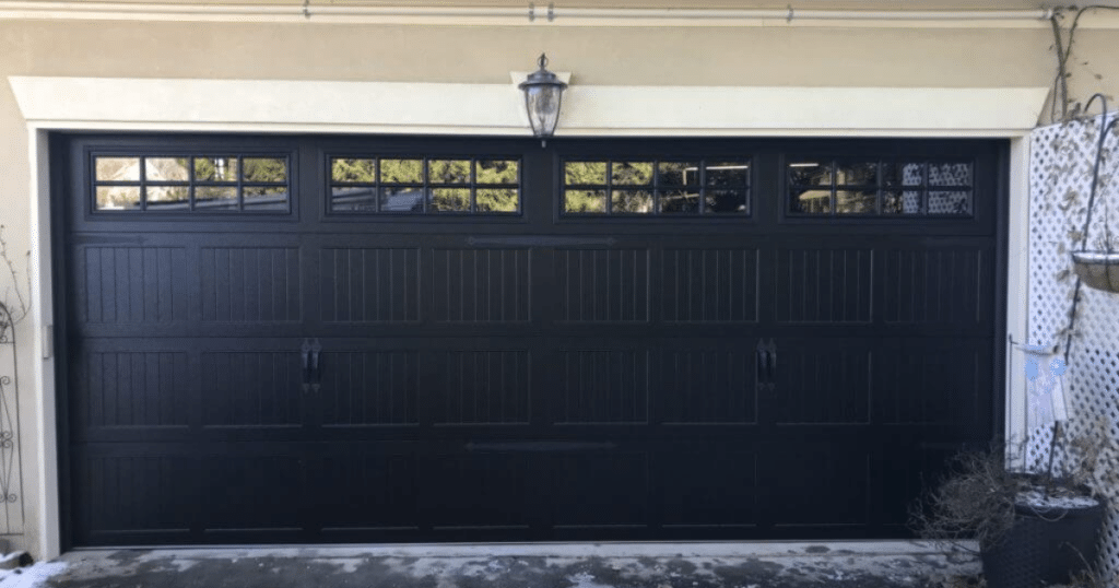 Black carriage-style garage with top windows