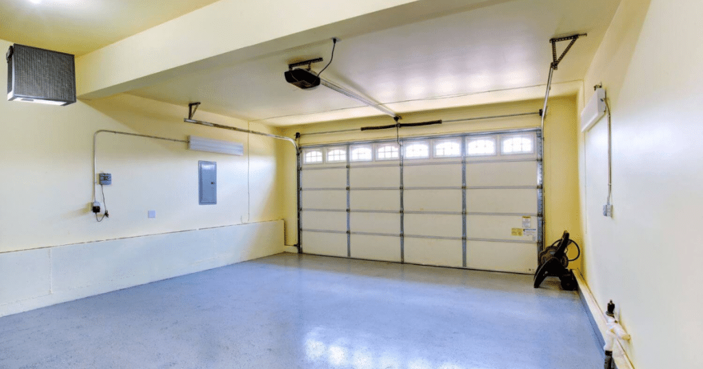 Clean garage with beige walls and opener